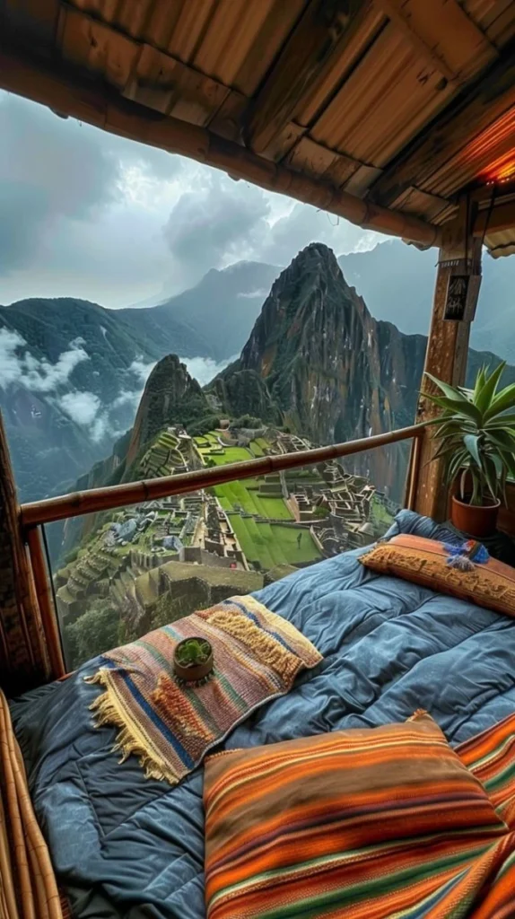 A cozy bed with colorful cushions overlooking Machu Picchu