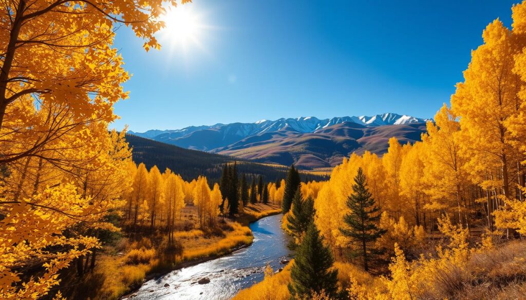 A scenic autumn landscape in Aspen, Colorado, bathed in golden sunlight filtering through the vibrant yellow aspen trees. In the foreground, a winding mountain stream cuts through the forest, its crystal-clear waters reflecting the stunning foliage. The middle ground features rolling hills covered in a patchwork of greens, reds, and oranges, with the majestic Rockies rising in the distance, their snow-capped peaks reaching towards the azure sky. A sense of tranquility and elegance pervades the scene, captured with a wide-angle lens to convey the grandeur of this picturesque mountain town in the heart of the American West.